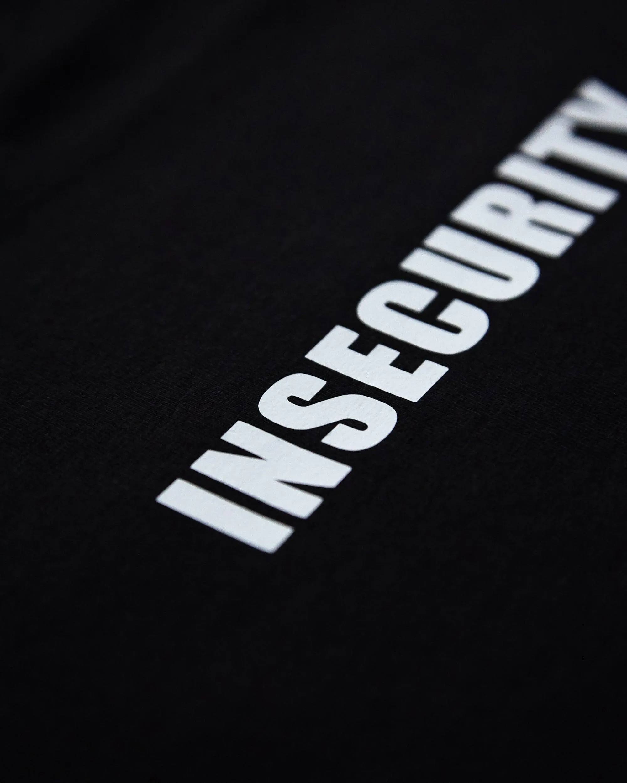 INSECURITY, white on black - pullover hoodie.